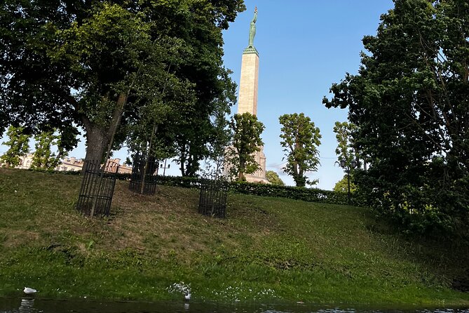 Riga Canal and Daugava Boat Tour with Welcome Drink & Audio Guide - Seeing the Freedom Monument from the water